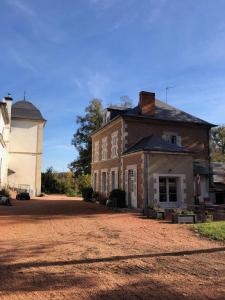 an old house with a silo and a barn at 2 bedroom Gîte-Cottage- Chateau de Charmeil in Charmeil