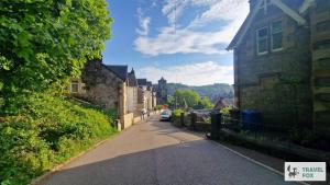 an empty street in a small town with houses at High Street Stay - Oban in Oban