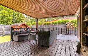 a porch with a couch and chairs on a deck at Cozy Home In Erm With Wifi in Erm +26 photos