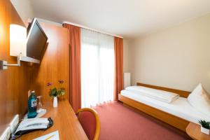 Postel nebo postele na pokoji v ubytování Hotel Restaurant Vater Rhein