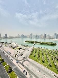 an aerial view of a highway with a city in the background at Waterfront Modern loft overlooking downtown 3BR in Sharjah