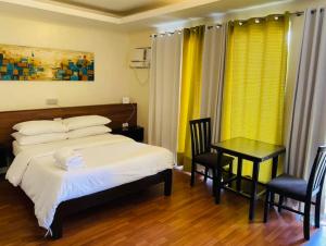 Postel nebo postele na pokoji v ubytování Tans Guesthouse