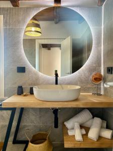 a bathroom with a sink and a mirror at View Terrace Apartment in Taormina - Murmuria Eolia in Taormina +31 photos
