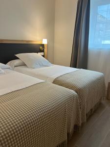 Ένα ή περισσότερα κρεβάτια σε δωμάτιο στο Arenas Suites