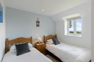 Voodi või voodid majutusasutuse Stable Cottage Nanternis toas