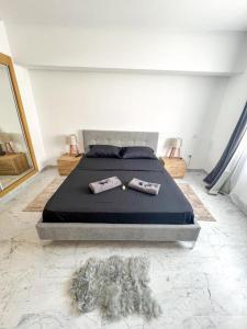 a bedroom with a bed with two towels on it at Amazing 2BR Apartment in Tunis in Tunis