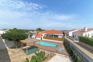 an aerial view of a house with a swimming pool at Esteva CountryHouse in Rogil