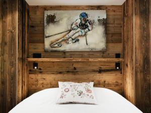a painting of a baseball player on a wall at Beau 4 pièces rénové au coeur du village, proche ski et loisirs - FR-1-304-206 in La Clusaz