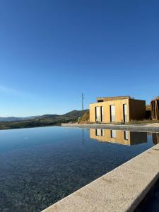 a building in the middle of a body of water at Five Sabrosa Senses in Sabrosa +29 photos