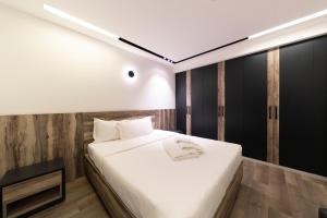 Ένα ή περισσότερα κρεβάτια σε δωμάτιο στο La Maison De Hamra Hotel Apartments