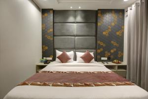 Ένα ή περισσότερα κρεβάτια σε δωμάτιο στο Hotel The Kaca International