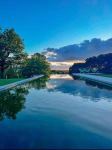 a view of a river at sunset at Chambre au cœur de la nature 