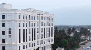 a white building with a lot of windows at SAS Central in Salalah