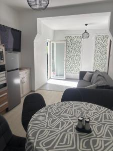 a living room with a couch and a table at Origo II in Debrecen