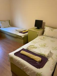 Postel nebo postele na pokoji v ubytování VEZO Apartment