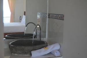 a bathroom with two sinks in a room at Rivera Beach in Amed +63 photos