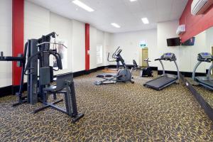 a gym with several treadmills and elliptical machines at Royal On The Park in Brisbane