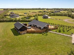 an aerial view of a house in a field at Holiday Home Gizella - 500m to the inlet by Interhome in Spottrup