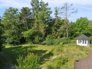 a view of a garden with a gazebo at Holiday Home Thora - 800m from the sea by Interhome in Nyrup +21 photos