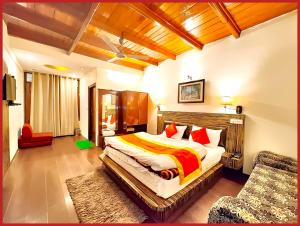 a bedroom with a large bed in a room at HOTEL THE MOON - Near Mall Road & Naini Lake View - LIFT -Free Parking -Restaurant -Wi-Fi Available- Ambience with Valley- A Top Rated Hotel IN Nainital in Nainital +23 photos
