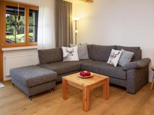 a living room with a couch and a coffee table at Apartment La Siala Apt-19 by Interhome in Falera +42 photos