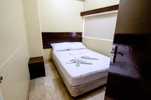 Tempat tidur dalam kamar di GV Hotel - Pagadian