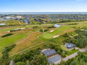 an aerial view of the golf course at the resort at Holiday Home Øthger - 1-3km from the sea by Interhome in Ringkøbing