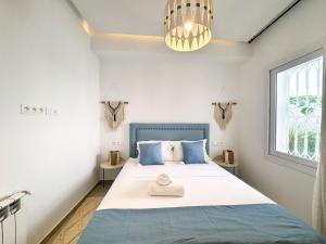 Postel nebo postele na pokoji v ubytování Rayhana Apartment 2 Bedrooms