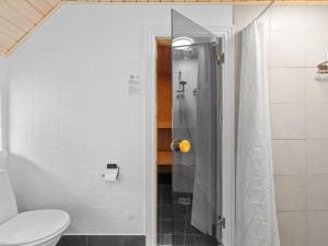 a bathroom with a shower and a toilet at Holiday Home Erle - 830m from the sea by Interhome in Nyby