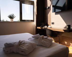 a hotel room with a bed and a window at Hotel Giada Viale del Sole in Vicenza +31 photos
