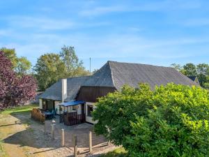 a house with a gambrel roof at Holiday Home Eiko - 400m to the fjord by Interhome in Storvorde