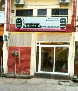 a store front of a building with a parking meter at Kanha Guest House in Varanasi