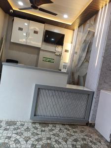 a reception desk in a building with a window at Kanha Guest House in Varanasi