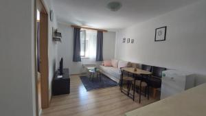 a living room with a couch and a table at Apartman Mario in Tomislavgrad