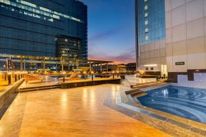 a swimming pool in the middle of a building at Sunday Hotel & Residences by CheckIn, Gurugram in Gurgaon