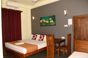 Voodi või voodid majutusasutuse Leaf Dew Resort toas