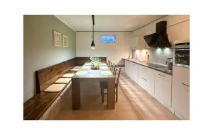 a kitchen with a dining room table with chairs at Nice Home In Benkovac in Benkovac