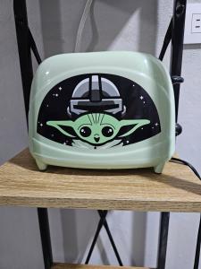 a toaster sitting on top of a table at Quincho's Place in Santa Ana