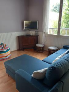 TV a/nebo společenská místnost v ubytování Belle Arcachonnaise Rêve Bleu