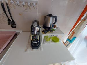 a coffee maker on a counter in a kitchen at La Consolata in Aosta