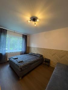 Katil atau katil-katil dalam bilik di Cat Garden Classic Apartments Riga