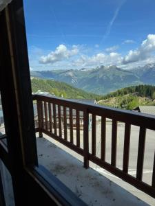 a view of the mountains from a balcony at Studio La Plagne Villages in La Plagne Tarentaise