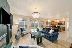 a living room with a couch and a table at Boise Hills Luxurious Retreat in Boise