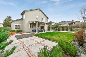 a home with a backyard with a lawn at Boise Hills Luxurious Retreat in Boise