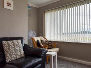 Posezení v ubytování Dolphin Cottage