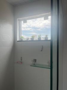 Ένα μπάνιο στο Apartamento aconchegante e completo +62 φωτογραφίες