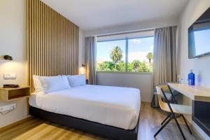 Ένα ή περισσότερα κρεβάτια σε δωμάτιο στο room Select Porto