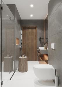 ein Badezimmer mit Toilette und Waschbecken in der Unterkunft West Baltic City in Stettin