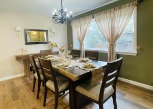 a dining room with a wooden table and chairs at Private Estate, Walk to Princeton Downtown, 3-Bedrooms 2-Bath with Free Parking in Princeton