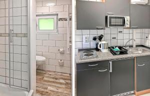 una pequeña cocina con lavabo y aseo en Fh Maisgelb, en Warenthin